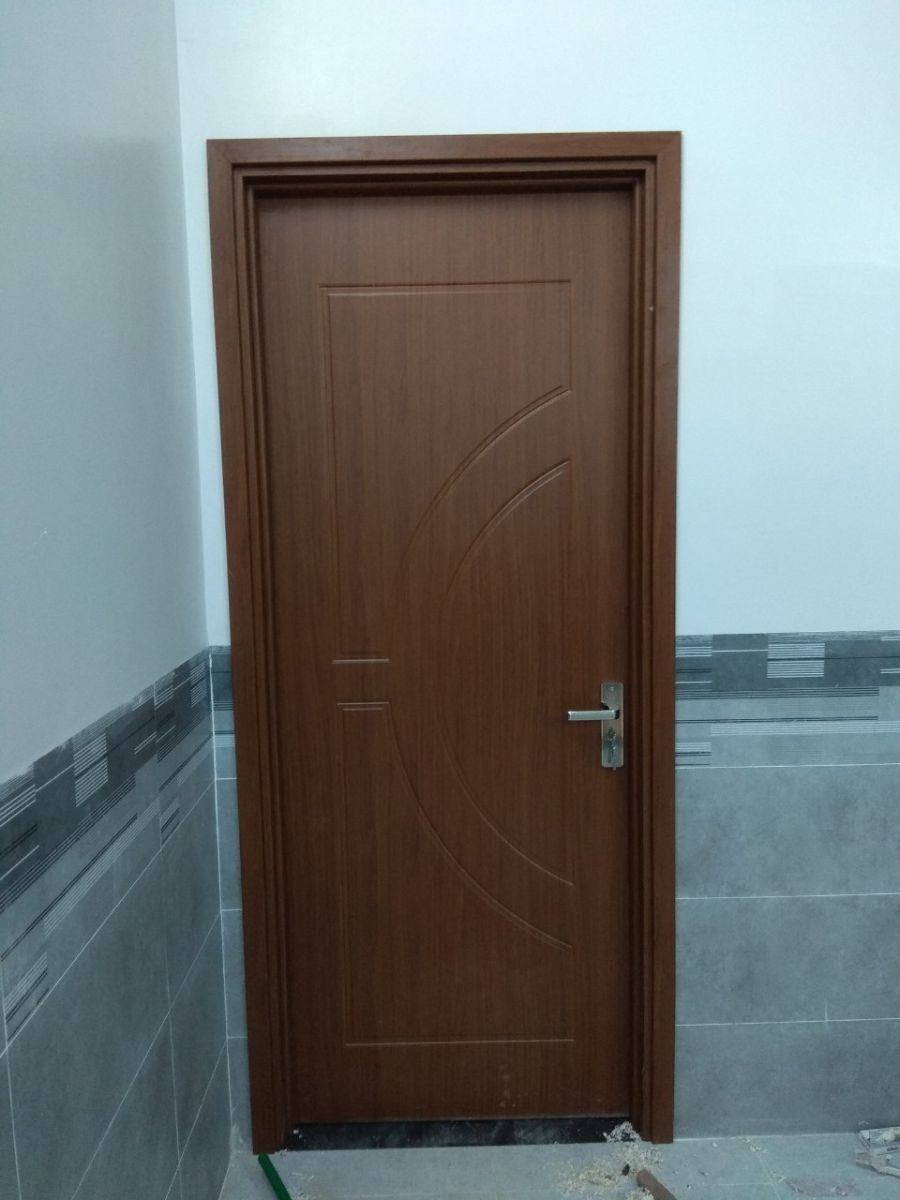 composite plastic single leaf bedroom door 900x2200 installation in Thu Duc HCM