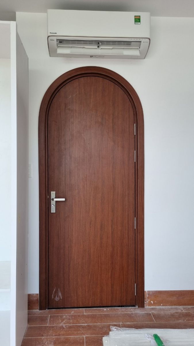 cửa vòm cong nhựa gỗ an gia phát lắp cho phòng ngủ